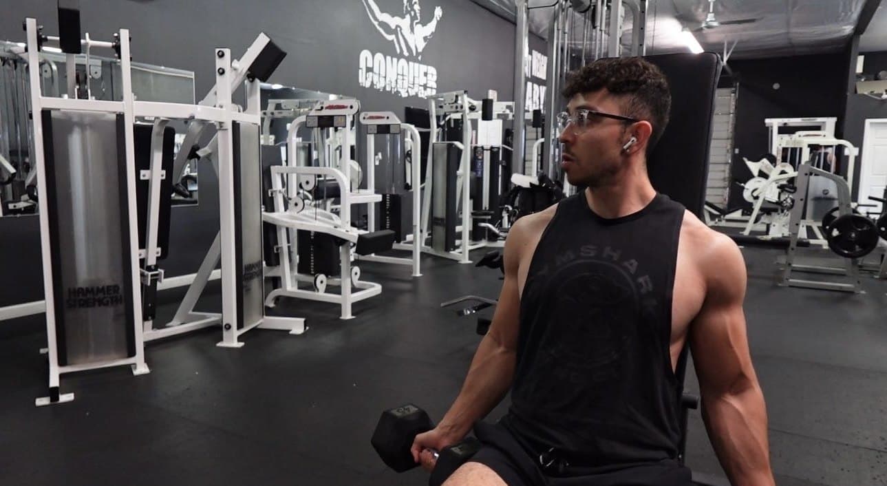 Hector Guerrero training with a dumbbell in the gym